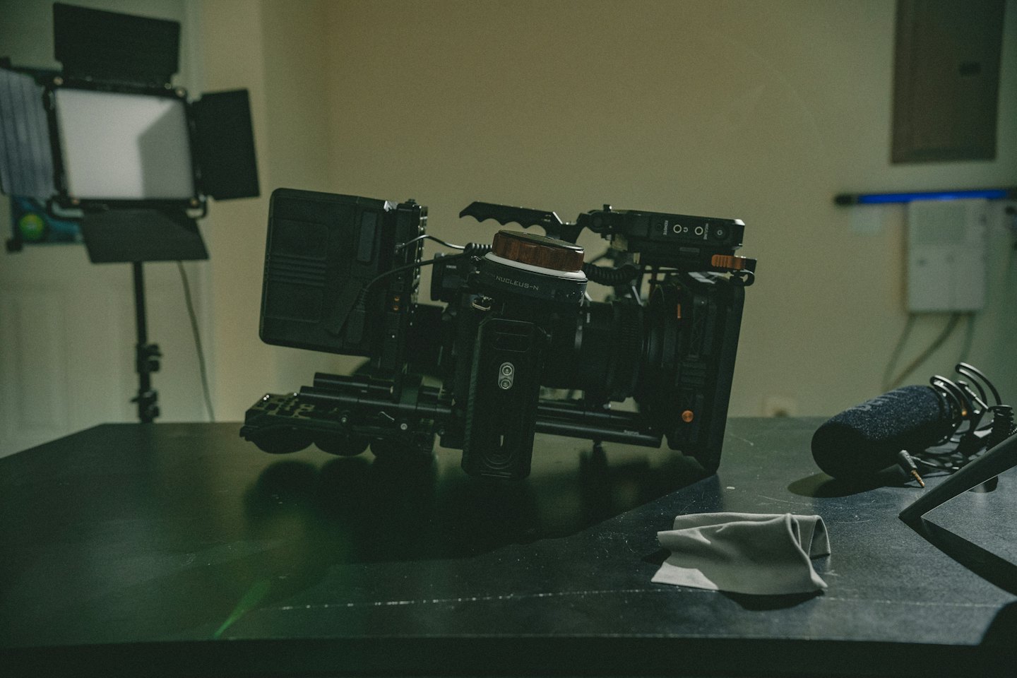 Professional video camera rig on a reflective table.
